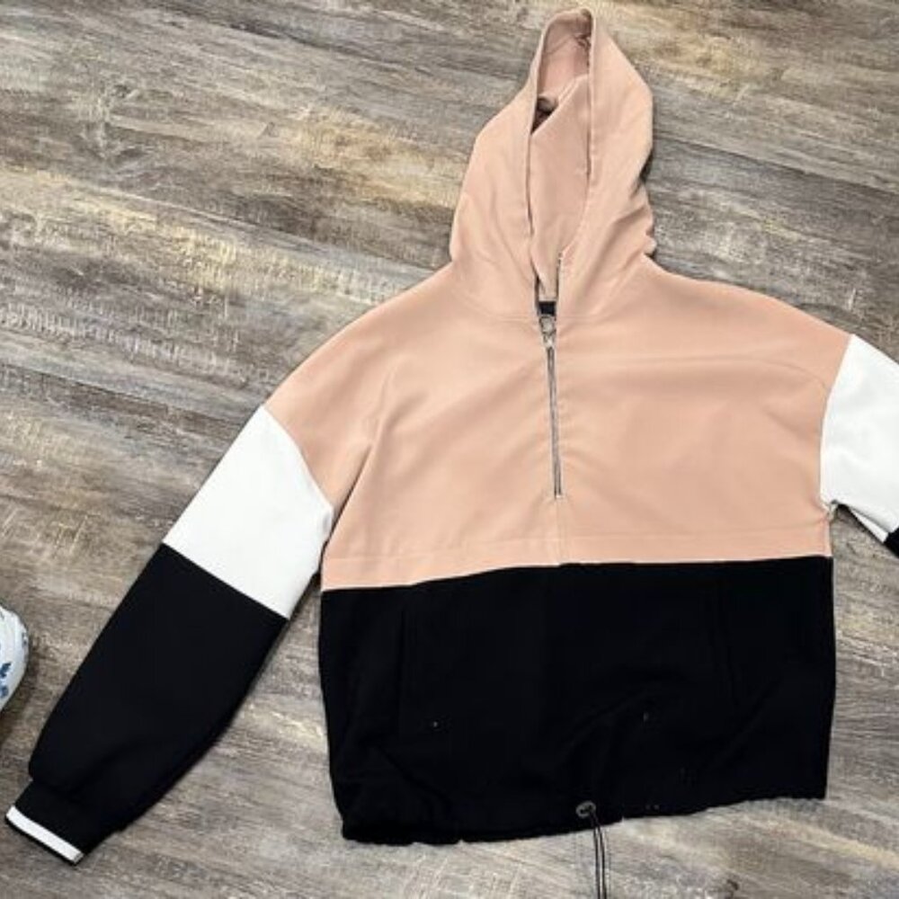 A women's pullover hoodie/jacket with a 1/4 zipper up